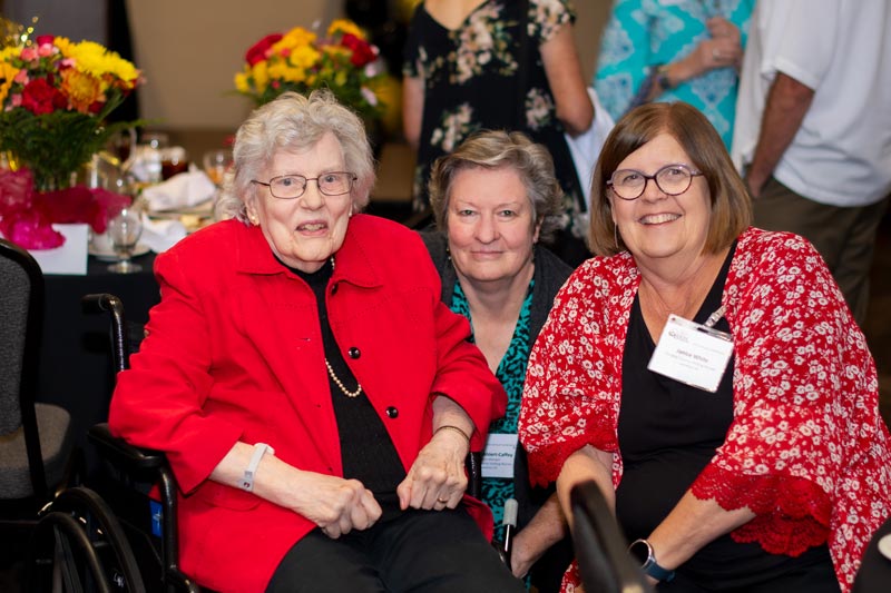 Janice (right) poses for a photo with Marceil Lauppe (left) and Debbie Ahlert-Caffey (middle) at a Kansas Home Care and Hospice Association conference.