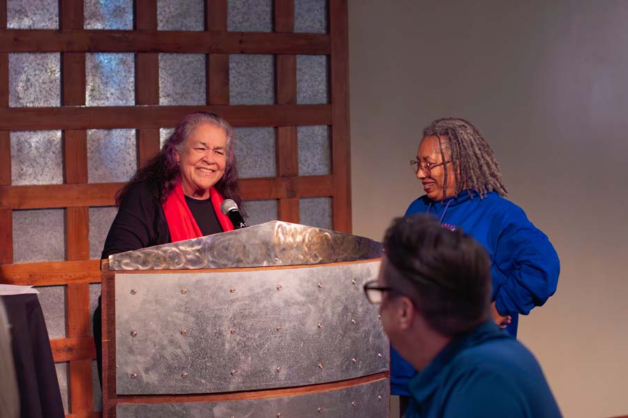 Nonie addresses her colleagues after being named the 2025 employee of the year. 